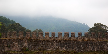 Ancient Roman Fortress with hills in clouds on the background. Gonio. Georgia.の写真素材