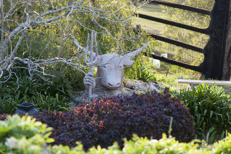 Sculpture of Zeus-bull with trident in his hand  Bingie  Nsw  Australia の写真素材