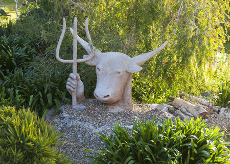 Sculpture of Zeus-bull with trident in his hand  Bingie  Nsw  Australia の写真素材