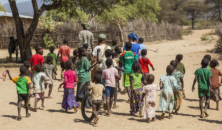 WEITA. OMO VALLEY. ETHIOPIA - DECEMBER 29, 2013: Unidentified tsemay children in traditional tribal village. Despite government efforts to fight poverty it is still widespread in Ethiopia.のeditorial素材