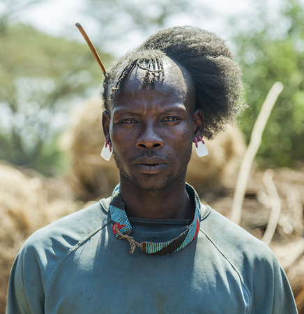 WEITA. OMO VALLEY. ETHIOPIA - DECEMBER 29, 2013: Traditionally dressed unidentified man from Tsemay tribe. Most Omo Valley people maintain their traditional way of life.のeditorial素材