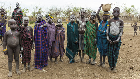 MAGO NATIONAL PARK OMO VALLEY ETHIOPIA  JANUARY 01 2014: Unidentified children from Mursi tribe in Mirobey village.のeditorial素材