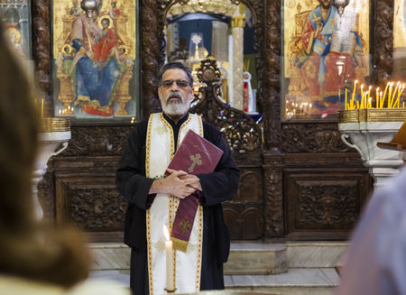 NAZARETH. ISRAEL - OCTOBER 25, 2014: Child baptism in Greek Orthodox Basilica of the Annunciation.のeditorial素材