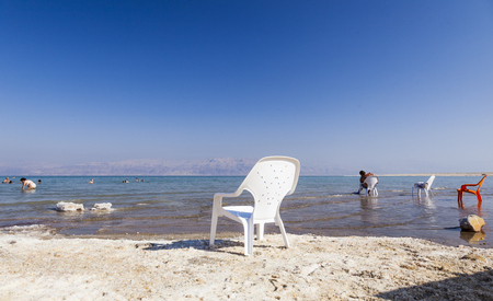 DEAD SEA, ISRAEL - OCTOBER 10, 2014: Unidentified people rest on the Ein Gedi Beach. Dead Sea is the lowest point in earth.のeditorial素材