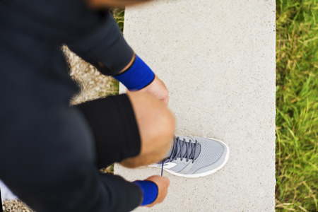 Runner tying his shoes