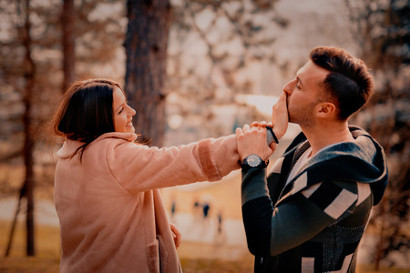 Young Beautiful Couple heaving fun outdoors at park in nature. Nice atmosphere with full of love.の写真素材