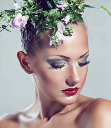 beautiful young sensual woman  with flowersの写真素材