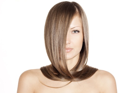 closeup portrait of a beautiful young woman with elegant long shiny hair , hairstyle , isolated on white backgroundの写真素材