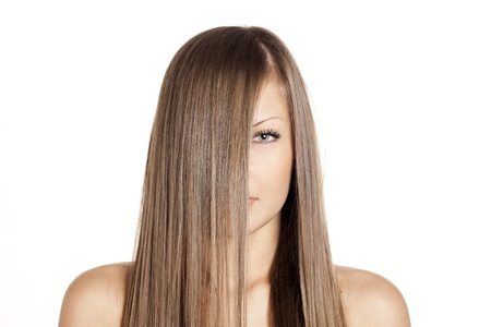 closeup portrait of a beautiful young woman with elegant long shiny hair , hairstyle , isolated on white backgroundの写真素材