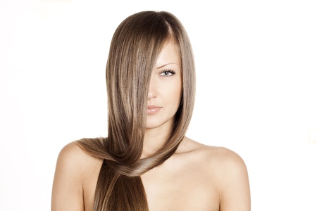 closeup portrait of a beautiful young woman with elegant long shiny hair , hairstyle , isolated on white backgroundの写真素材