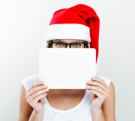 Christmas Santa hat  woman portrait   Smiling happy girl  の写真素材