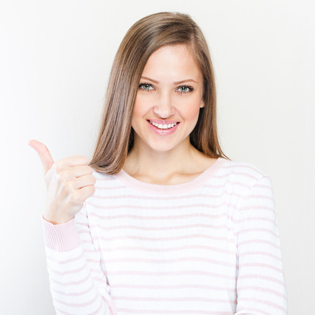 Young casual style woman portrait isolated over white backgroundの写真素材