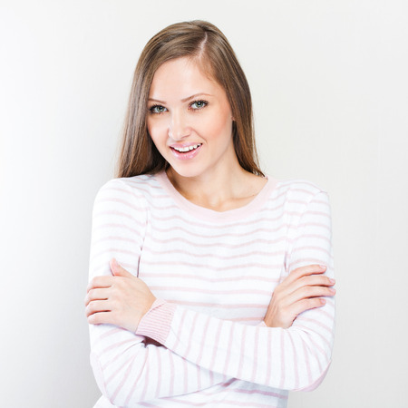 Young casual style woman portrait isolated over white backgroundの写真素材