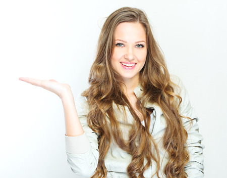 Beautiful young woman with long curly hairsの写真素材