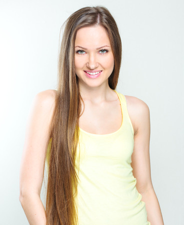 Beautiful young woman with long hairの写真素材
