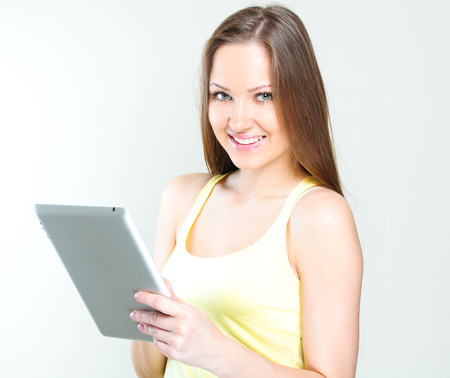 young woman holding tablet computerの写真素材