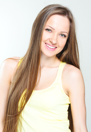 Beautiful young woman with long hairの写真素材
