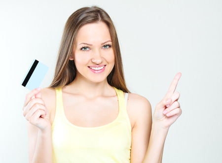 woman holding credit cardの写真素材