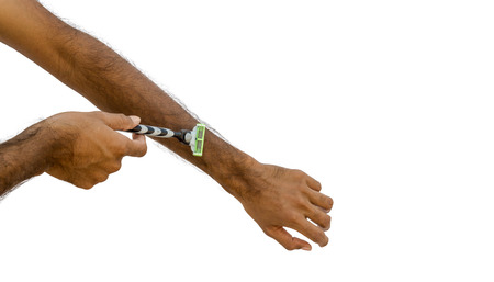 Picture of a Razor blade shaving brown arm hair isolated on white background.の写真素材