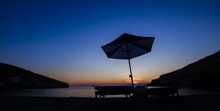 clear blue sky with umbrella at night on the beach of Crete Greeceの写真素材