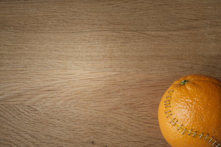 orange with stainless steel stitches that hold the husk togetherの写真素材