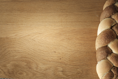 3 kinds interwoven bread lying on a wooden table with copy space. food conceptの写真素材