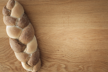 3 kinds interwoven bread lying on a wooden table with copy space. food conceptの写真素材