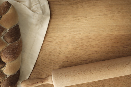bread with rolling pin on a wooden table with copy space, food conceptの写真素材