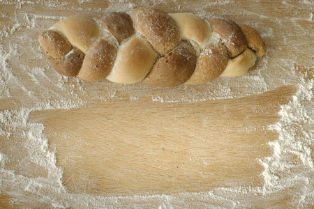 3 kinds interwoven bread lying on a wooden table with copy space. food conceptの写真素材