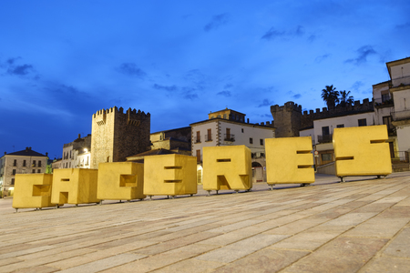 The Tower of Bujaco and the Main Square Plaza Mayor illuminated at night, Caceres, Extremadura, Spainのeditorial素材