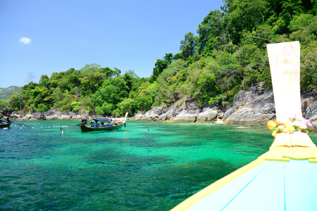 Longtail boat on crystal clear sea at tropical beach, Koh Lipe, Andaman Sea, Thailandの写真素材