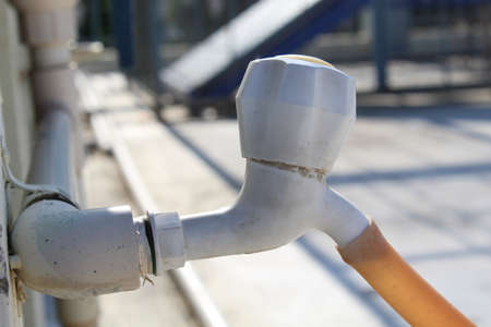 Water tap on terrace connected with pipe isolated blur backgroundの写真素材