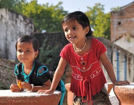 Khajuraho, India - November 27, 2009 - Two girls in real Indian village near Khajurahoのeditorial素材