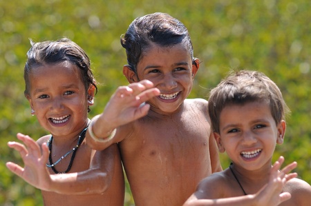 Khajuraho, India - November 26, 2009 - Joyful children in India after a dip in the lakeのeditorial素材