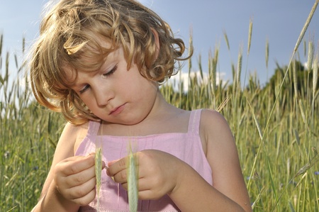 Happy, little girl in spikes crops.の写真素材