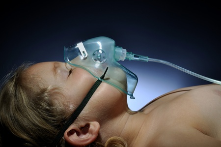 Little girl in mask oxygen.の写真素材