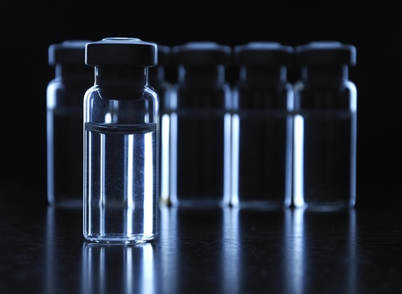 Vials of medication. dark blue.の写真素材