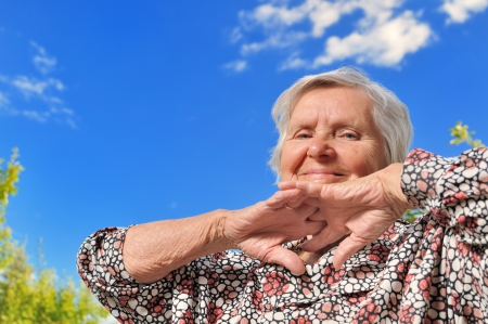 Senior woman - happy and smilling, outdoors の写真素材