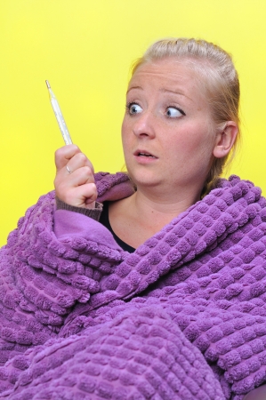 Sick woman with fever の写真素材