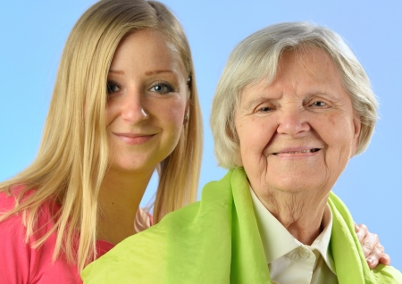 Child and grandchild give a gift their grandmother, expressing his care and love for her の写真素材