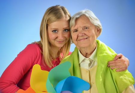 Grandmother and granddaughter, senior and young women の写真素材