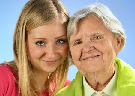 Grandmother and granddaughter, senior and young women の写真素材