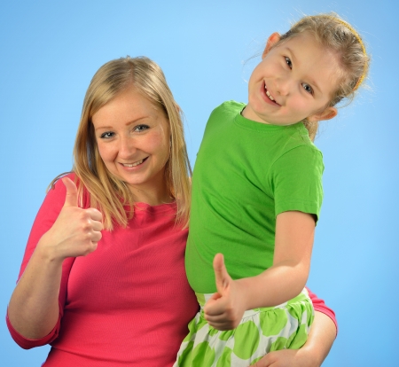 Young mother and her daughter  Happy and smiling family の写真素材