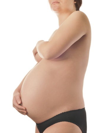 Pregnant woman with hands over tummy at white background の写真素材