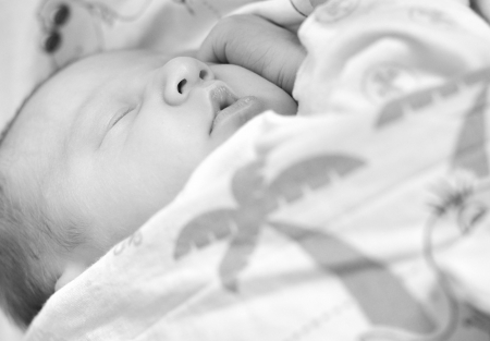 Sweet newborn baby sleeping の写真素材
