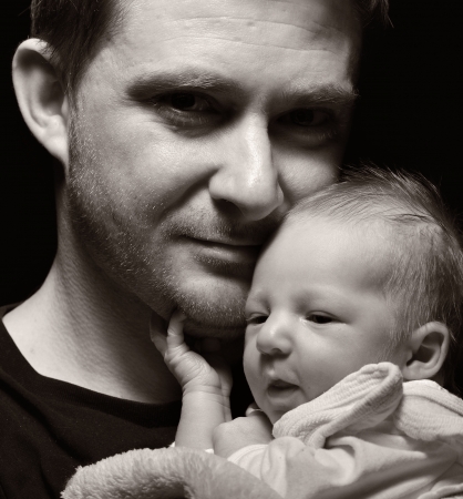 Father and his newborn baby の写真素材