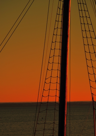 Mast of sailing ship at sunset 