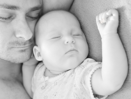 Father sleep with his baby の写真素材