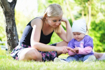 Mother and her baby in park  Happy family outdoors の写真素材