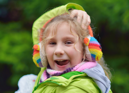 Happy, carefree girl playing in the park の写真素材